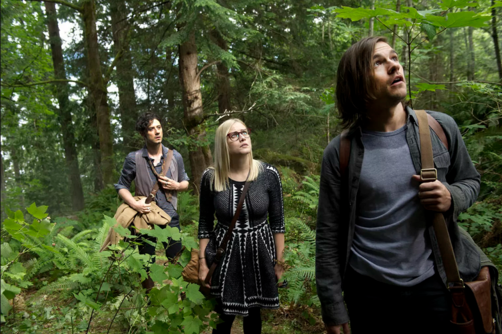 (L to R) Eliot, Alice, and Quentin explore the woods.