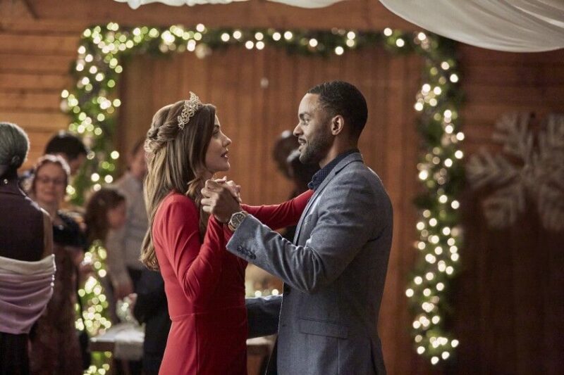 Julie Gonzalo and Ronnie Rowe Jr. IN Jingle Bell Bride courtesy of the Hallmark Channel